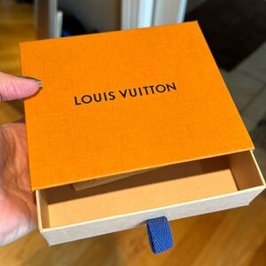 Louis Vuitton box and sleeper bag for a wallet
